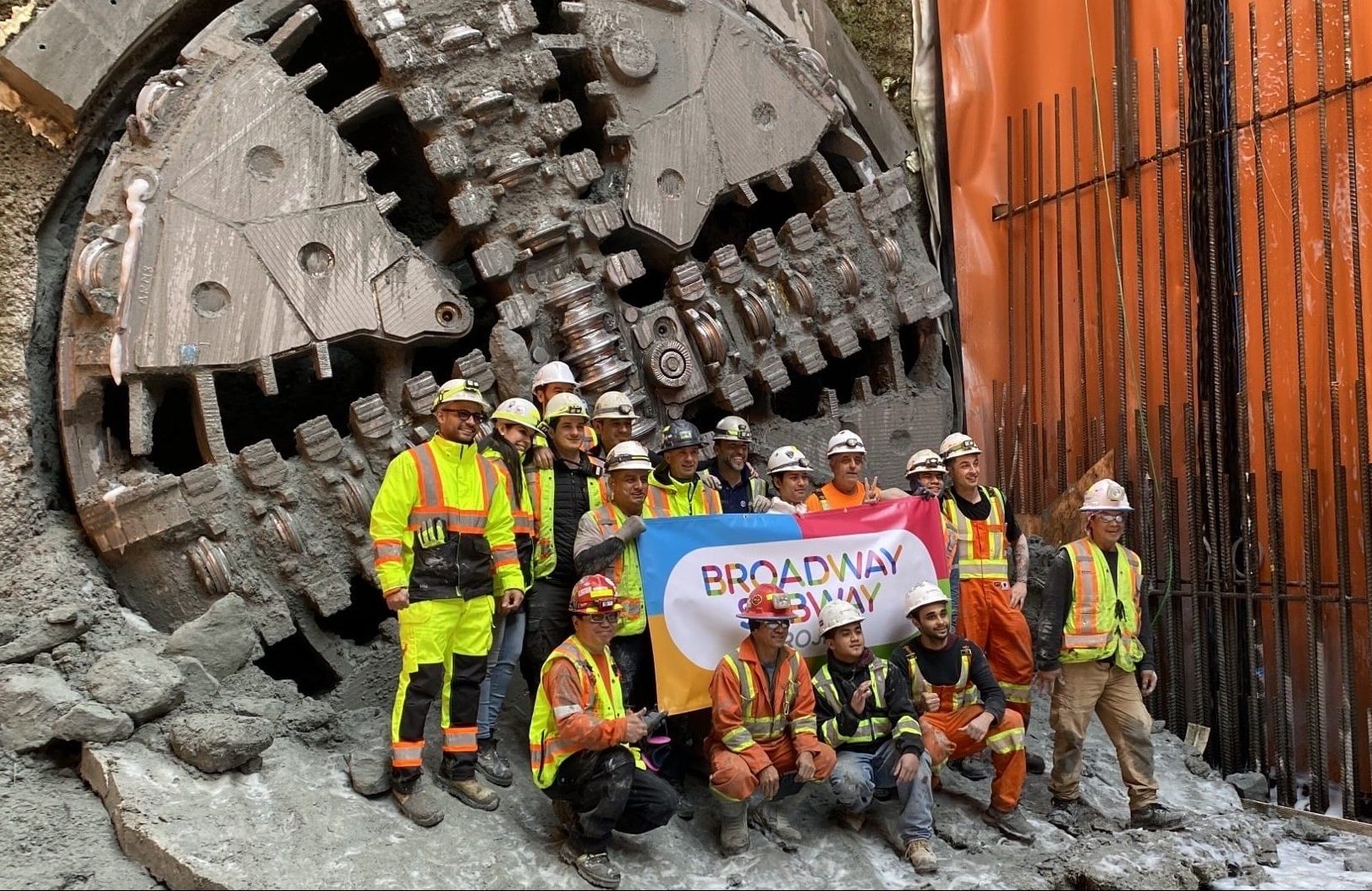 Picture of workers in front of the project