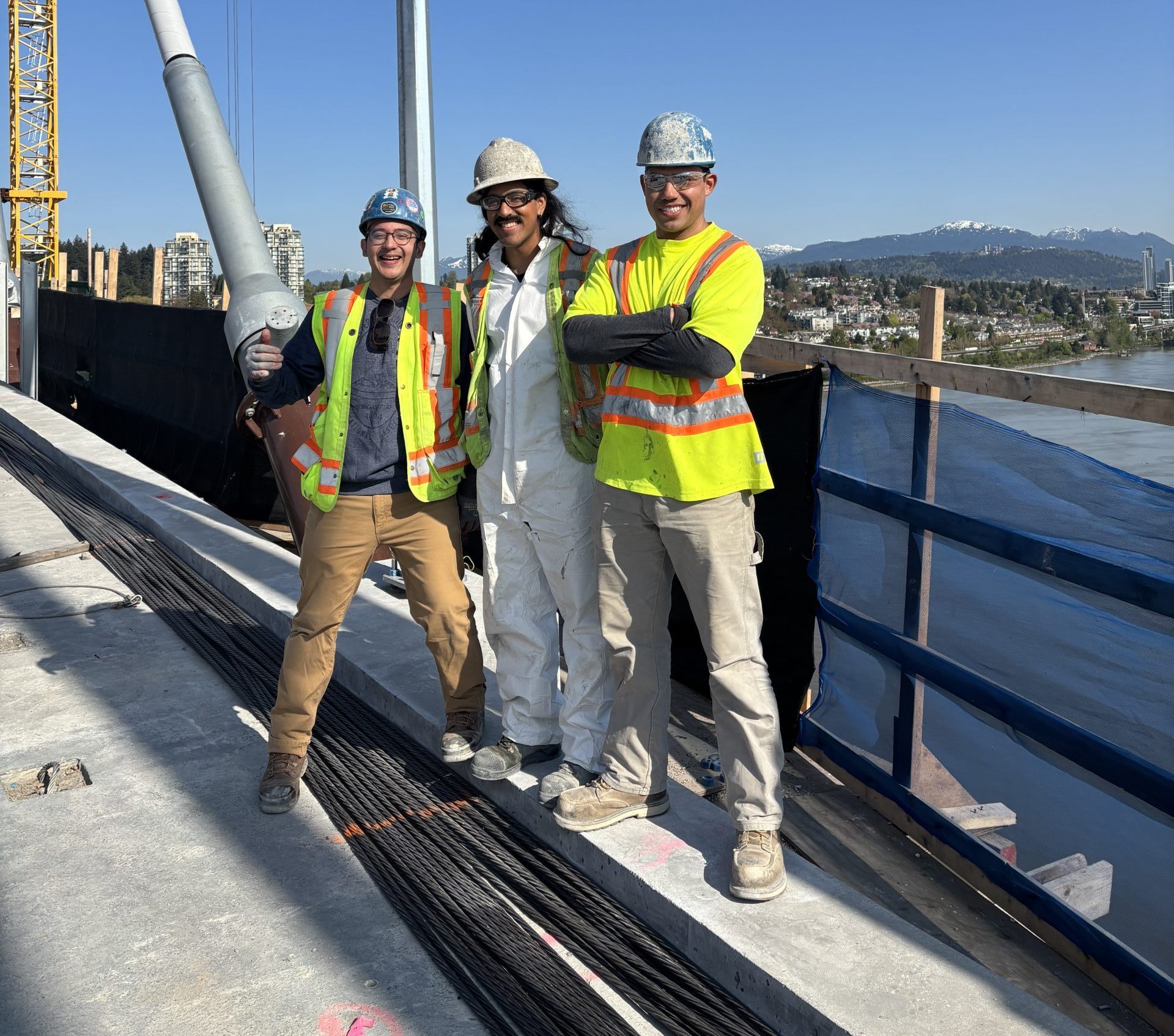 Three apprentices posing on the Pattullo Bridge.